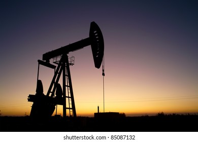 Pump Jack Silhouette At Sunset