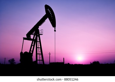 Pump Jack Silhouette At Sunset