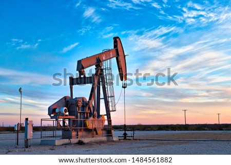Pump jacks in an oil field.