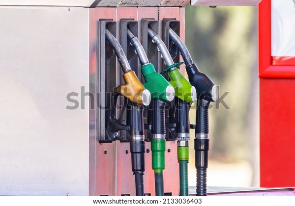 Pump nozzles\
of a petrol pump in service\
station