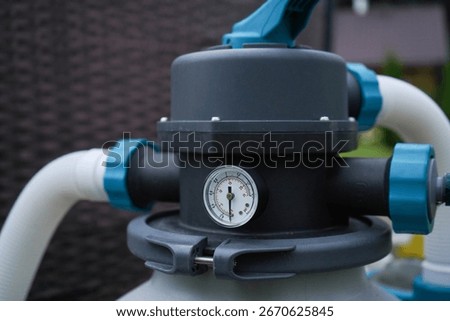 The pump responsible for filtering and ozonating to maintain a pristine outdoor swimming pool.