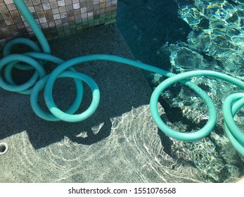 A Pump That Is Draining Water From The Hot Tub Into The Pool.