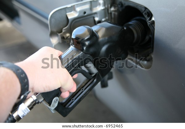 pumping gas into a\
car