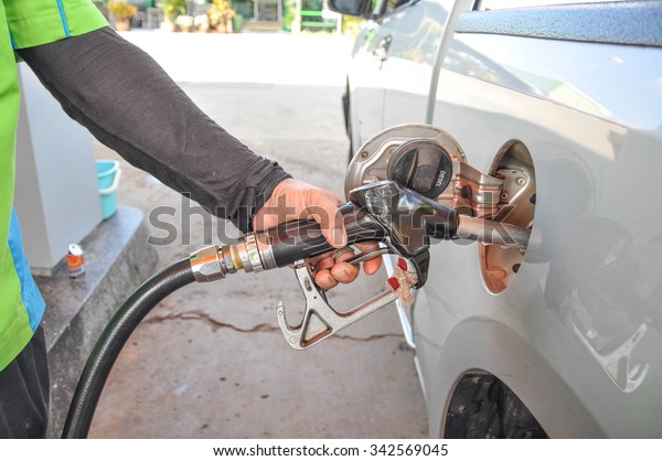 pumping gas at gas\
pump