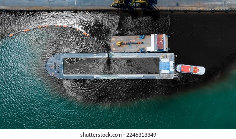 Pumping oil to Bulk Ship. Oil leak from Ship , Oil spill pollution polluted water surface water pollution as a result of human activities. industrial chemical contamination. oil spill at sea. - Powered by Shutterstock