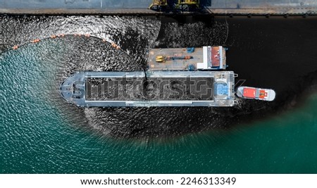 Pumping oil to Bulk Ship. Oil leak from Ship , Oil spill pollution polluted water surface water pollution as a result of human activities. industrial chemical contamination. oil spill at sea.