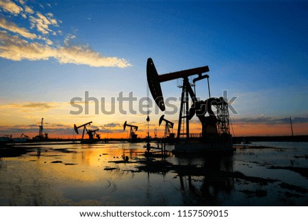 The pumping unit is working in the setting sun