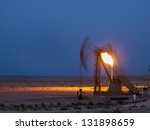 Pumpjack with flame at Pawnee National Grassland in Weld County, of northeastern Colorado.