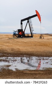 Pumpjack In Northern Alberta, Canada. A Piece Of Equipment Used In The Oil And Gas Industry.