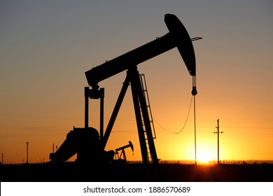 Pumpjacks, the sunset of New Mexico oil field, shot near Carlsbad. - Powered by Shutterstock