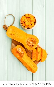 Pumpkin - Butternut Squash Sort - On Green Wooden Table Top View