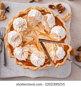 Pumpkin Cheesecake Swirl Pie Topped With Whipped Cream With A Slice Taken Out, Original Thanksgiving Dessert Idea, Overhead View