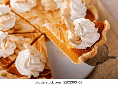 Pumpkin Cheesecake Swirl Pie Topped With Whipped Cream With A Slice Taken Out, Original Thanksgiving Dessert Idea, Overhead View