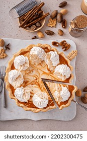 Pumpkin Cheesecake Swirl Pie Topped With Whipped Cream With A Slice Taken Out, Original Thanksgiving Dessert Idea, Overhead View