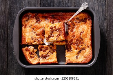 Pumpkin Chocolate Chips Sheet Cake Cut In Slices In A Baking Dish On Dark Wood Table, Horizontal View From Above, Flat Lay