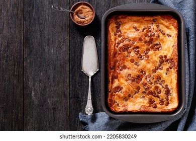 Pumpkin Chocolate Chips Sheet Cake In A Baking Dish On Dark Wood Table, Horizontal View From Above, Flat Lay, Free Space