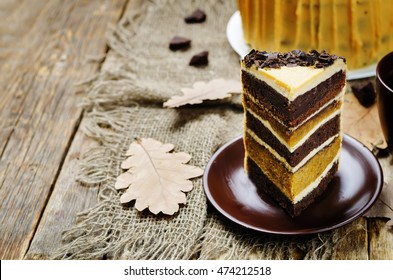 Pumpkin And Chocolate Layer Cake With Salted Caramel Cream Cheese Frosting. Toning. Selective Focus