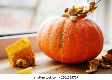 Pumpkin Cleaning Of Seeds. Autumn Seasonal Cooking. Fall Recipes 