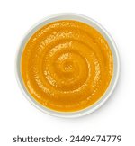 Pumpkin cream soup isolated on white background, top view