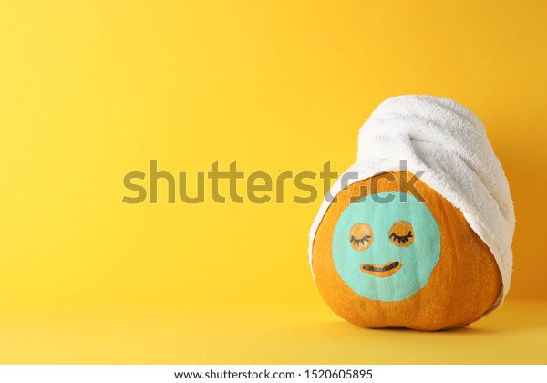 Download Pumpkin Facial Mask Towel On Yellow Stock Photo Edit Now 1520605895 PSD Mockup Templates