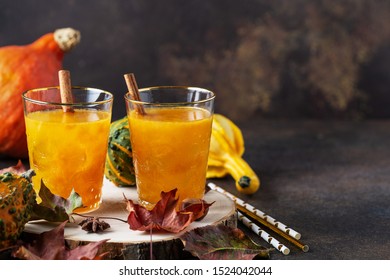 Pumpkin Fall Seasonal Cocktail  On Brown Stone Background