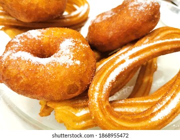 
Pumpkin Fritters And Churros With Sugar. Typical Mediterranean Food From Valencia Spain.