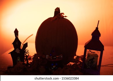 Pumpkin And Ghost And Goblin House In Silhouette