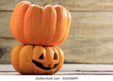 pumpkin halloween stack together on wood background.