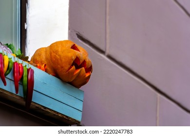 Pumpkin For Halloween With Traces Of Decay Is On The Windowsill