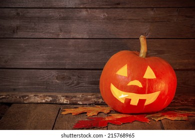 pumpkin head on wooden background with copy space