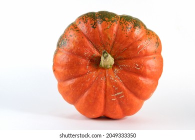 Pumpkin isolated on white with shadow and subtle reflection. Ripe ugly pumpkin, orange pumpkin. Harvest. Top view
