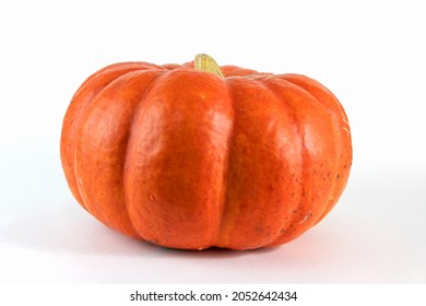 Pumpkin isolated on white with shadow and subtle reflection. Ripe ugly pumpkin, orange pumpkin. Harvest.