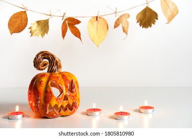 Pumpkin Lantern Jack And Burning Candles. Halloween Composition. Home Decor