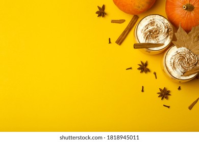 Pumpkin Latte Drink. Autumn Coffee With Spicy Pumpkin Flavor And Cream On A Yellow Background. Seasonal Fall Drinks For Halloween And Thanksgiving