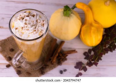 Pumpkin Latte With Spices And Whipped Cream On A White Wood Background. View From Above.