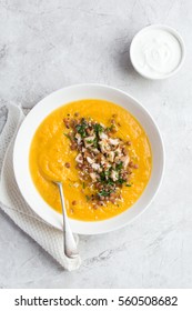 Pumpkin And Lentil Cream Soup In White Bowl, Top View