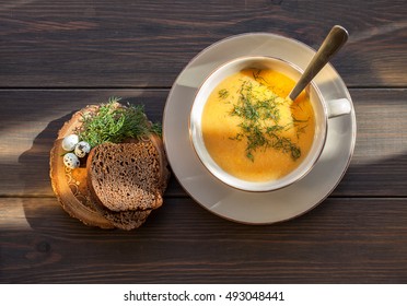 Pumpkin And Lentil Soup On Dark Wooden Background. Halloween Treat.