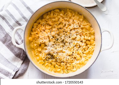 Pumpkin Mac And Cheese On A White Background And Rustic Dish And Napkin