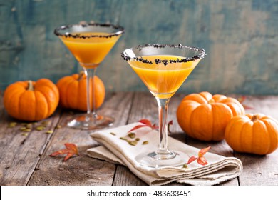 Pumpkin martini fall seasonal cocktail Pumpkintini with black salt rim