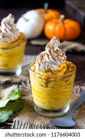 Pumpkin Mousse, Keto Low Carb Dessert, With Whipped Cream, Cinnamon And Coloured Pumpkins On Dark Background 