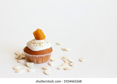 Pumpkin Muffin On A White Background With Pumpkin Seeds.