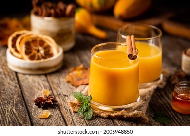 Pumpkin And Orange Spiced Fall Cocktail With Cinnamon