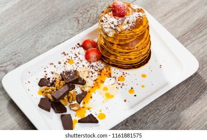 Pumpkin Pancakes Recipe - Mix Pumpkin Puree With Eggs, Olive Oil, Salt, Sugar, Milk Until Well Combined. Fry In Pan Without Oil. Serve With Honey, Chocolate, Cream, Fruits