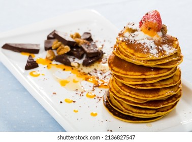 Pumpkin Pancakes Recipe - Mix Pumpkin Puree With Eggs, Olive Oil, Salt, Sugar, Milk Until Well Combined. Fry In Pan Without Oil. Serve With Honey, Chocolate, Cream, Fruits