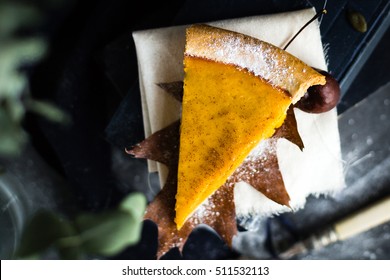 Pumpkin Pie Slice On Autumnal Decorated Table