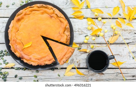 Pumpkin Pie For Thanksgiving Day And Cup Of Black Coffee On A Autumn Leaves And Wooden Background