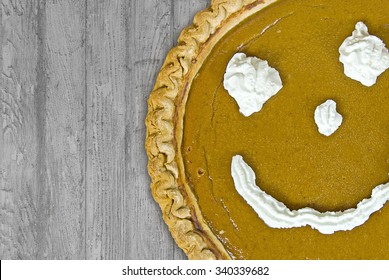  Pumpkin Pie With Whipped Cream Happy Face On Rustic Wood