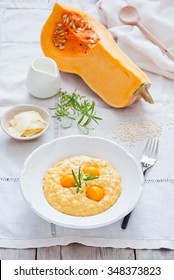 Pumpkin risotto with pickled pumpkin in a white plate