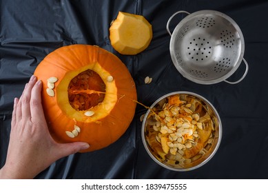 Pumpkin Seed Harvesting, Fresh Pumpkin With Top Cut Open, Bowl With Seeds And Pumpkin Guts
