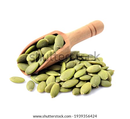 Pumpkin seed on white backgrounds. Healthy food ingredient.